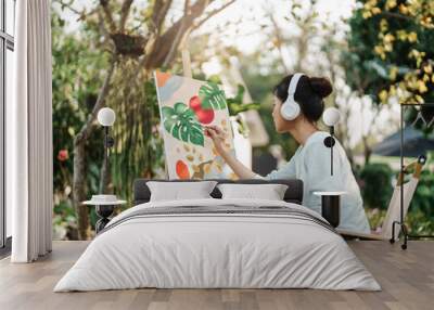 Female artist painting art canvas drawing with inspiration in garden art therapy creativity concept Wall mural